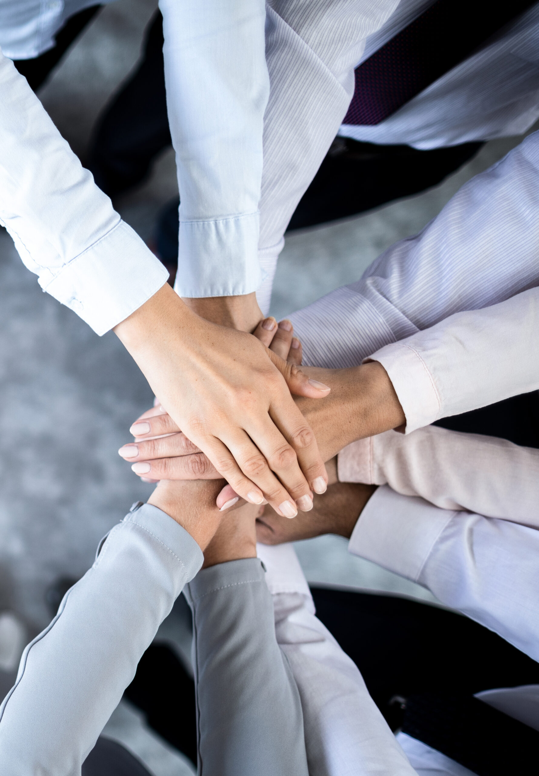 Close,Up,Top,View,Of,Young,Business,People,Putting,Their