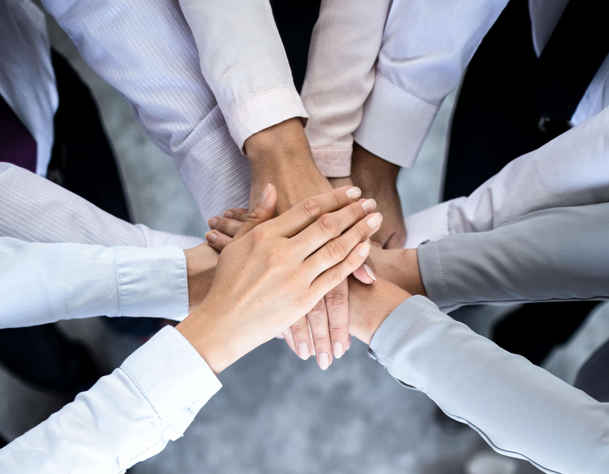 Close,Up,Top,View,Of,Young,Business,People,Putting,Their